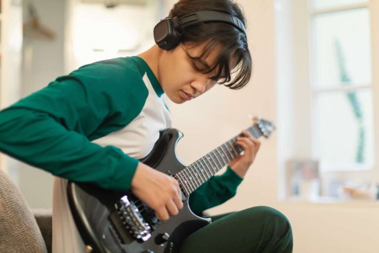 Young boy playing the guitar